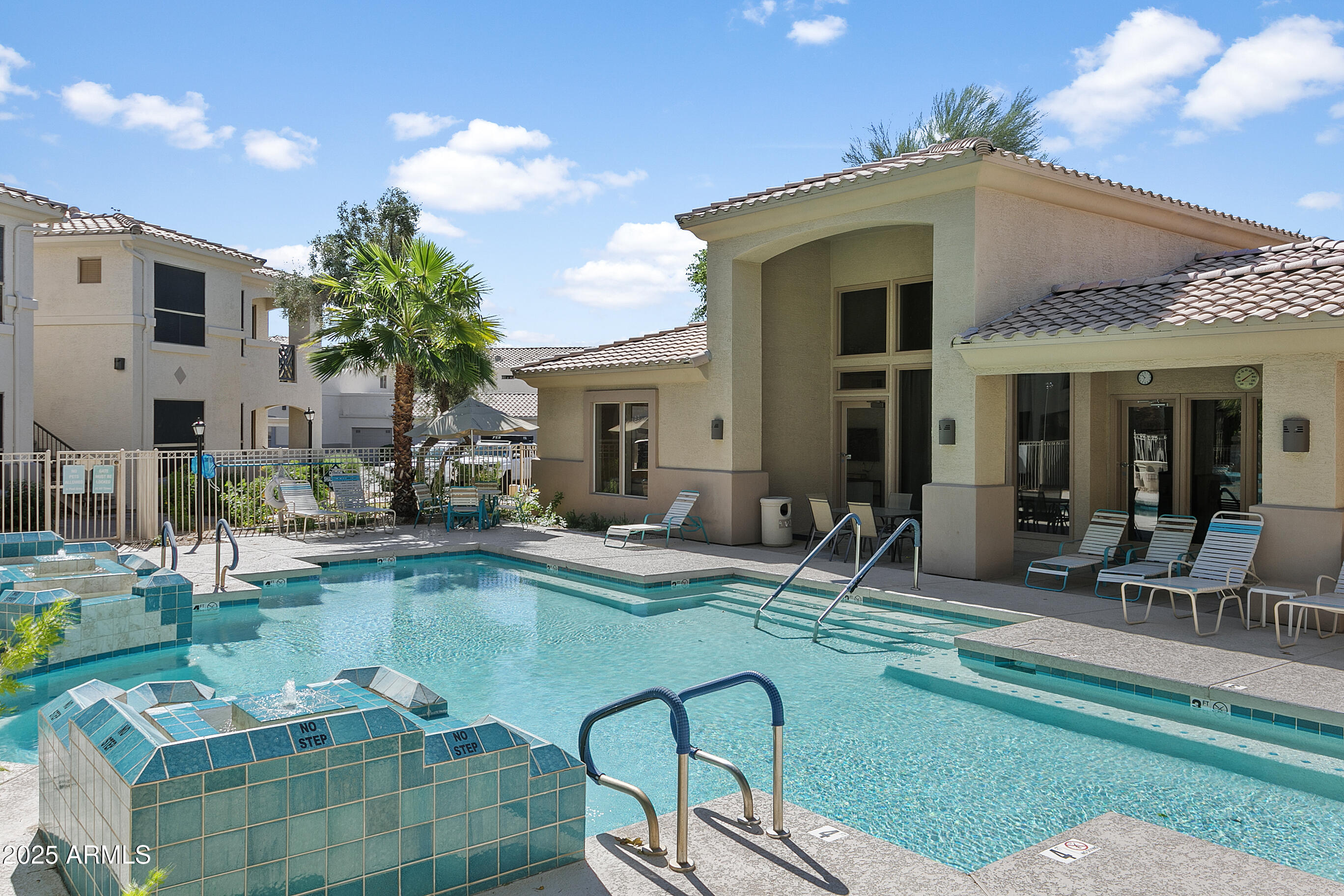 9550 East Thunderbird Road, Unit 228 Scottsdale, AZ 85260 - Photo 25 of 29 a swimming pool with outdoor seating and yard