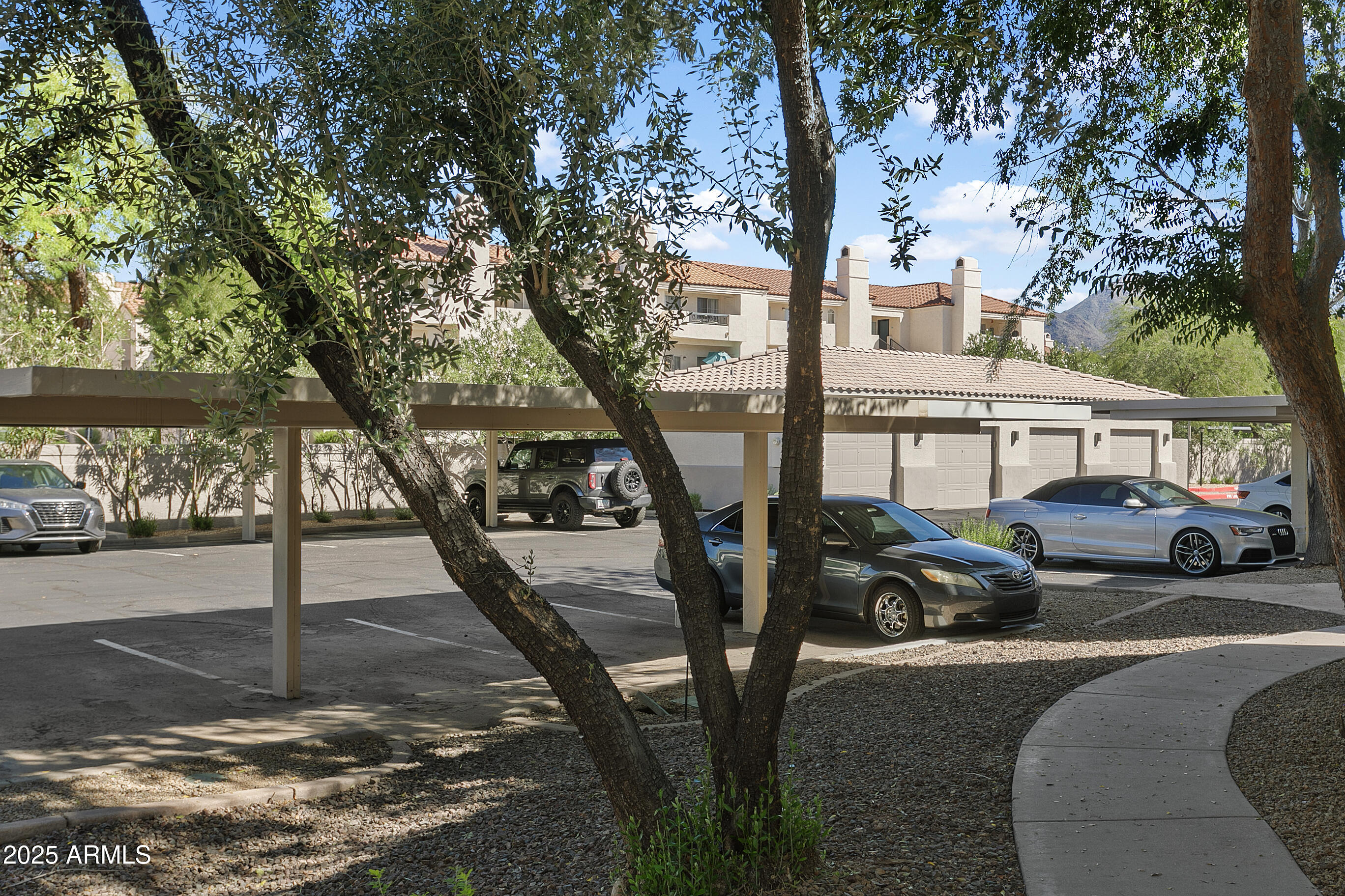 9550 East Thunderbird Road, Unit 228 Scottsdale, AZ 85260 - Photo 26 of 29 a view of a car park in front of a house