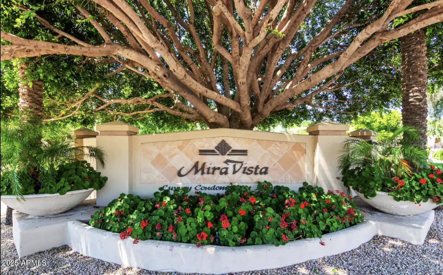 9550 East Thunderbird Road, Unit 228 Scottsdale, AZ 85260 - Photo 28 of 29 a sign that is in front of flowers