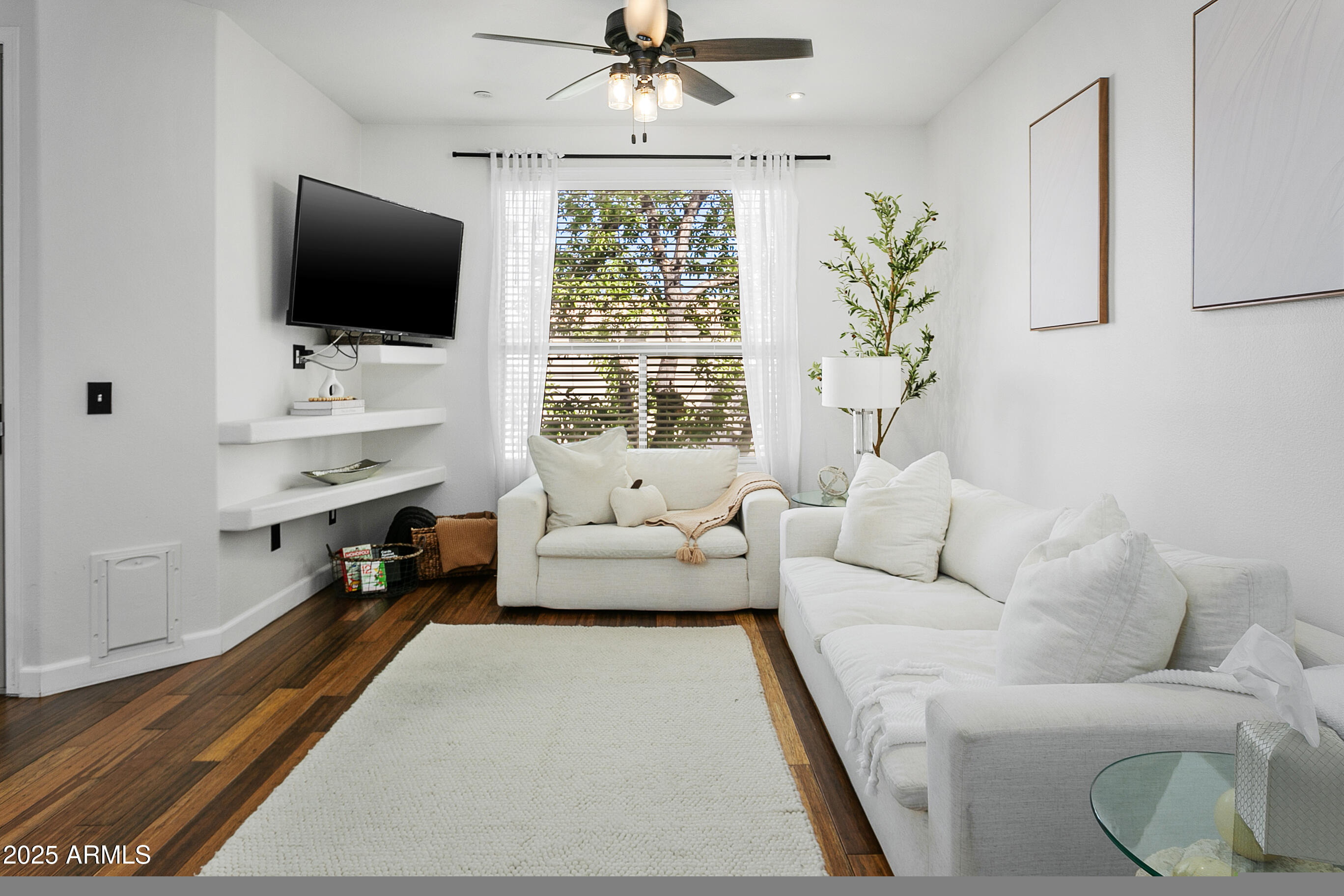 9550 East Thunderbird Road, Unit 228 Scottsdale, AZ 85260 - Photo 3 of 29 a living room with furniture and a flat screen tv