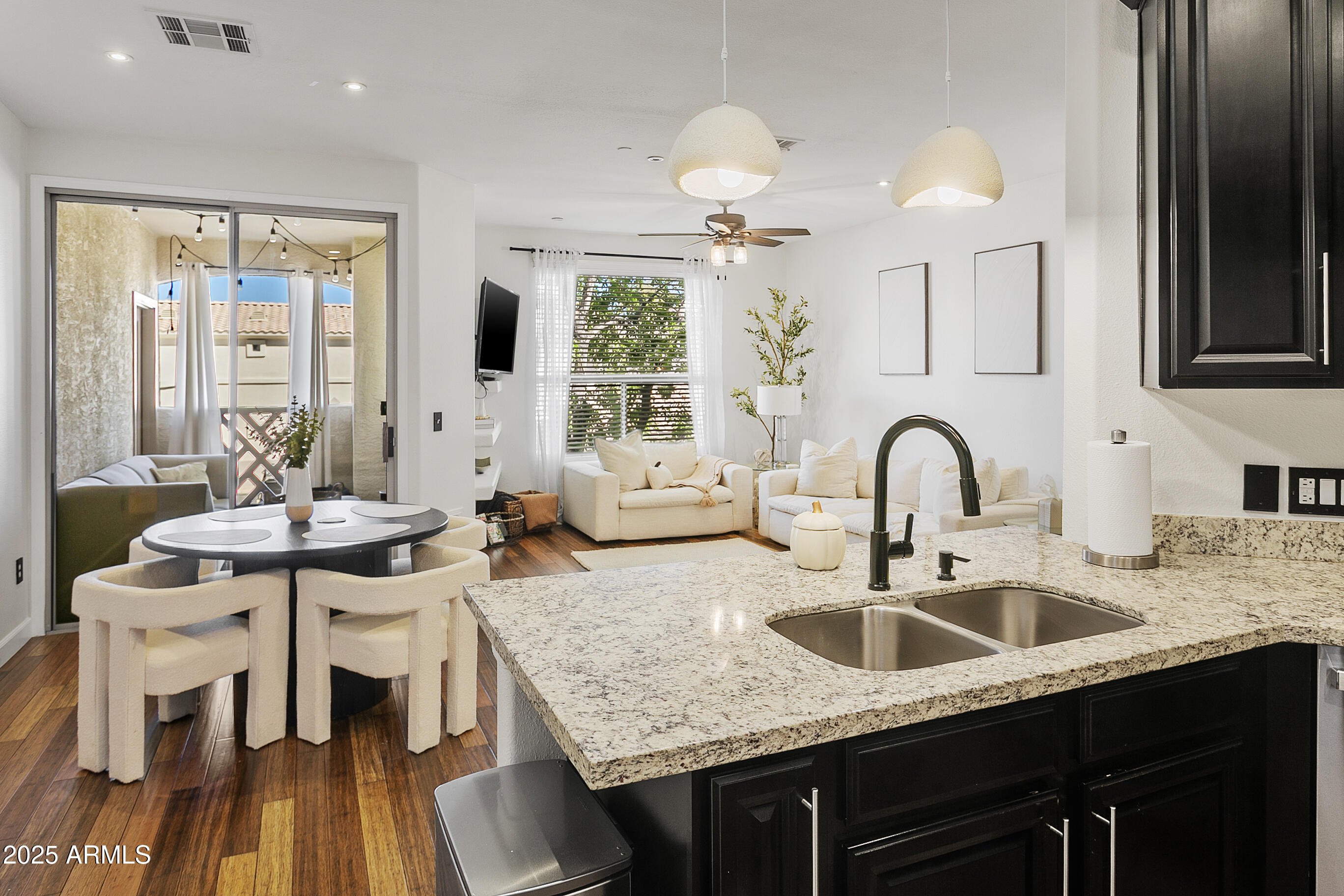 9550 East Thunderbird Road, Unit 228 Scottsdale, AZ 85260 - Photo 10 of 29 a kitchen with granite countertop stainless steel appliances a sink stove and cabinets
