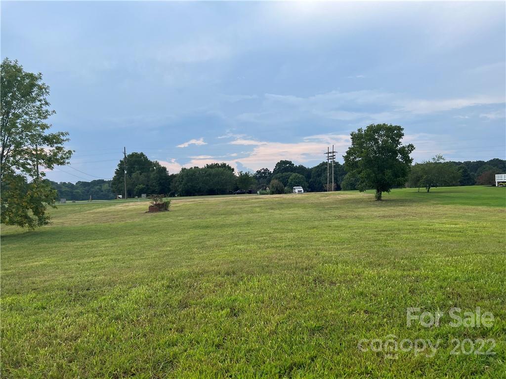 2421 Long Hope Road Monroe, NC 28112 - Photo 11 of 14 a view of a lake with a big yard