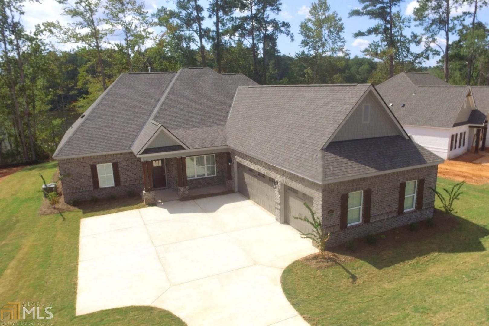 a aerial view of a house with a yard