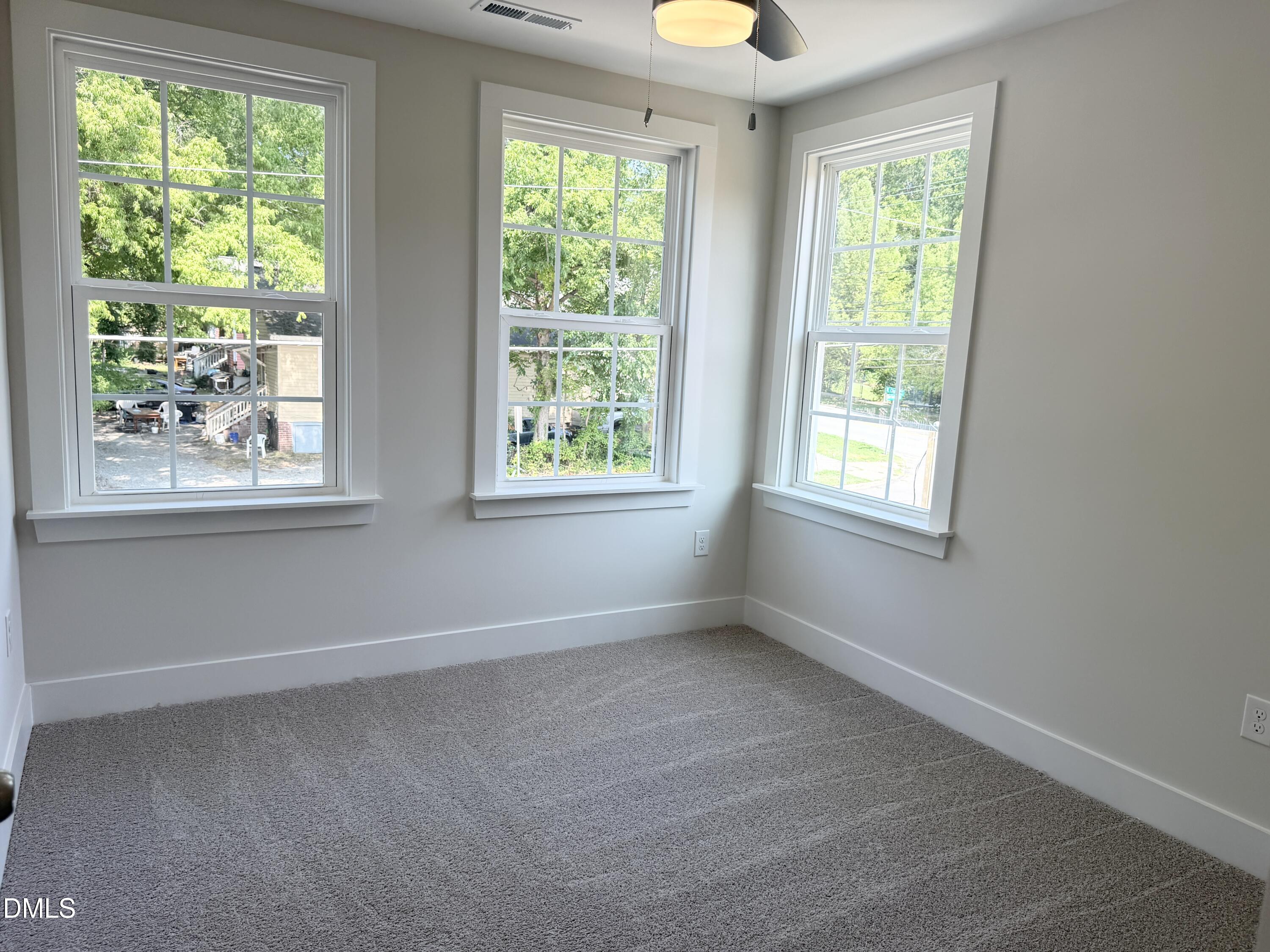 1122 Berkeley Street Durham, NC 27705 - Photo 21 of 29 a view of an empty room with a window