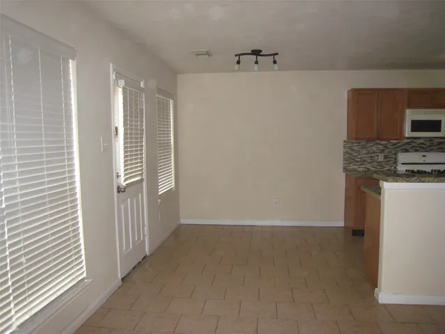 a view of a kitchen with a sink