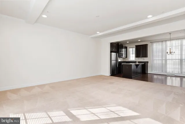 a large kitchen with cabinets and stainless steel appliances
