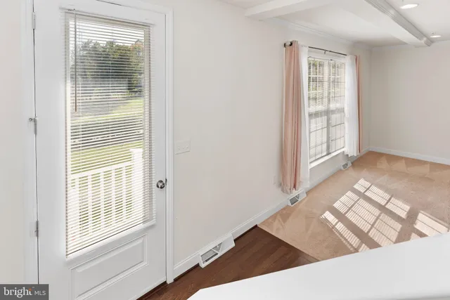 a view of an empty room and window