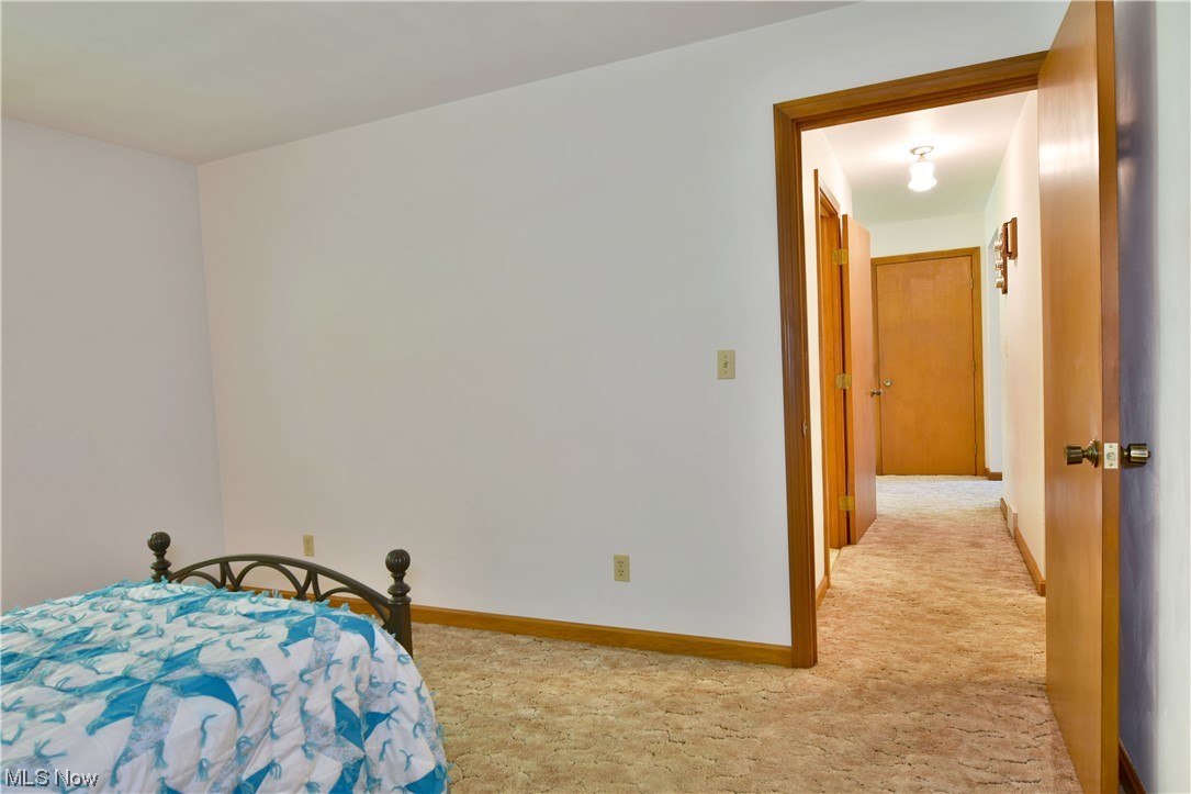 1943 Kale Adams Road Southwest Warren, OH 44481 - Photo 21 of 35 View of carpeted bedroom