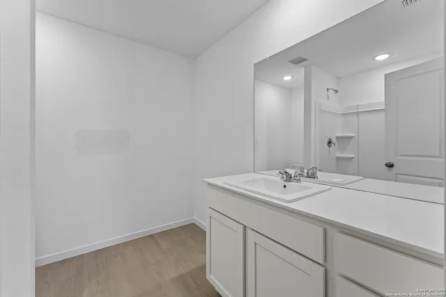 a bathroom with a sink and a mirror