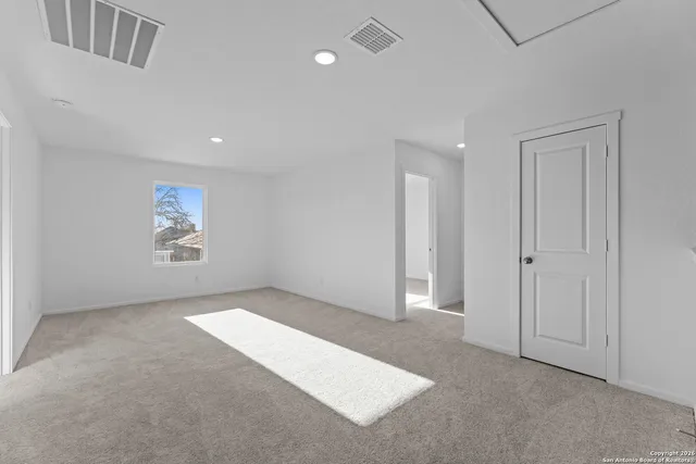 an empty room with windows