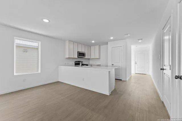 a view of kitchen with wooden floor