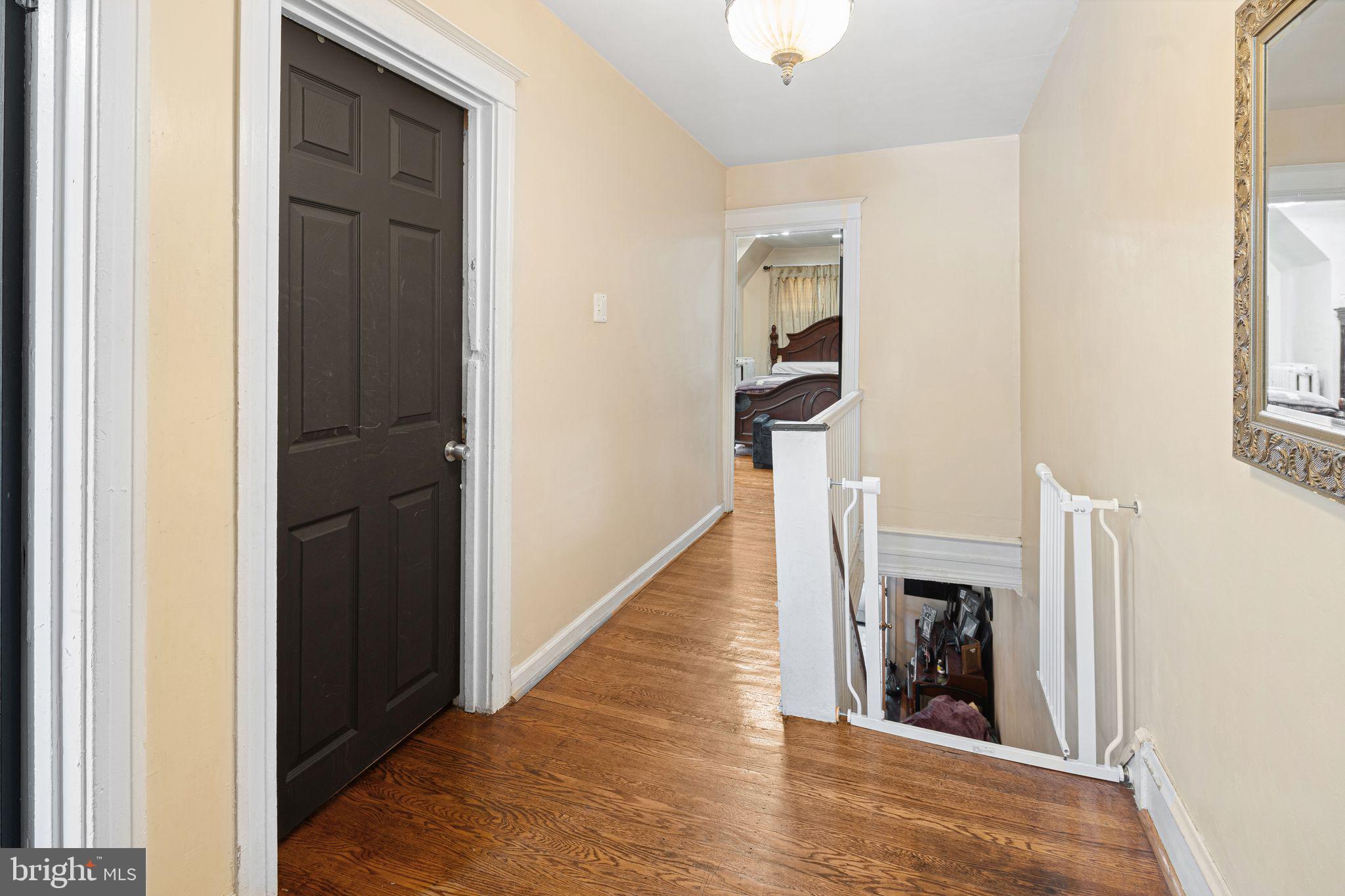 144 Fairview Avenue Lansdowne, PA 19050 - Photo 14 of 39 a view of a hallway with wooden floor and staircase