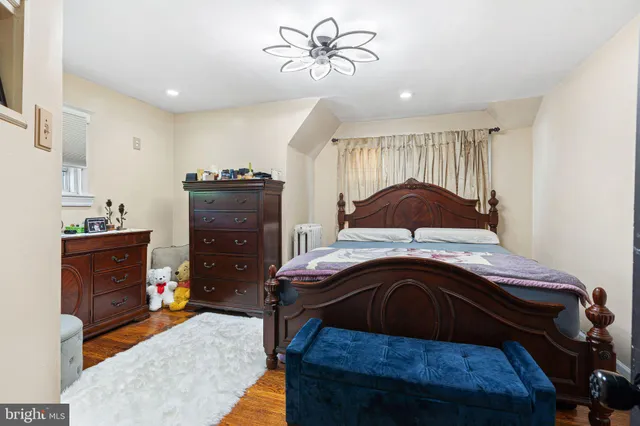 a bedroom with a bed and a mirror