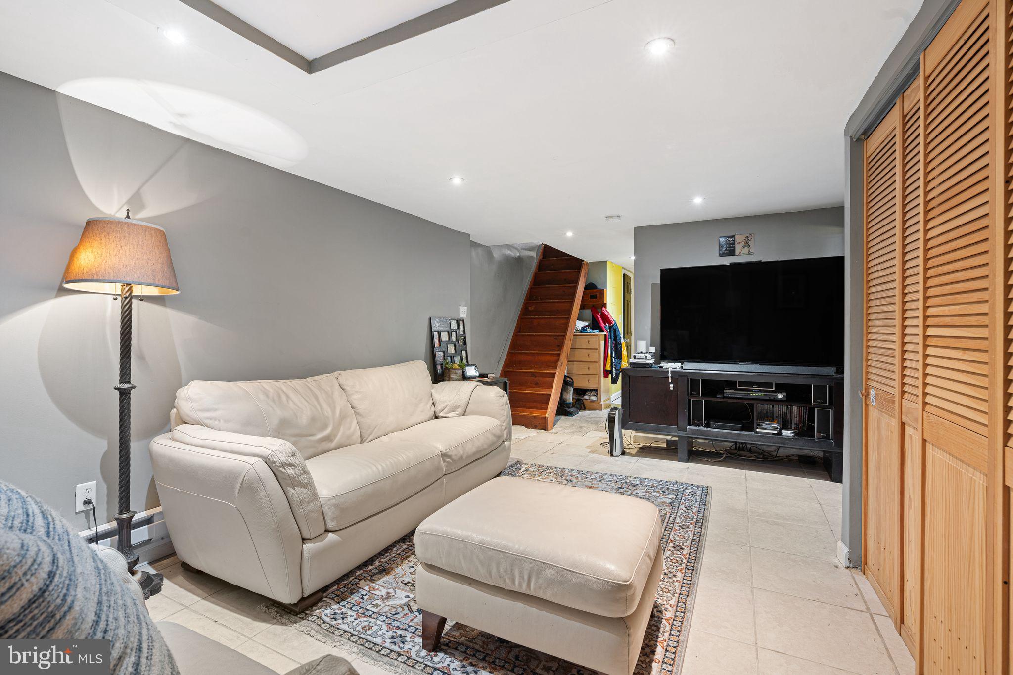 144 Fairview Avenue Lansdowne, PA 19050 - Photo 23 of 39 a living room with furniture and a flat screen tv