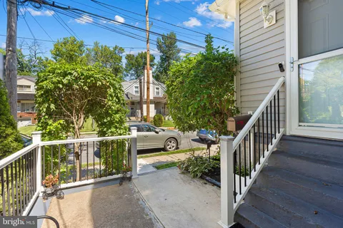 a view of balcony with wooden floor and fence