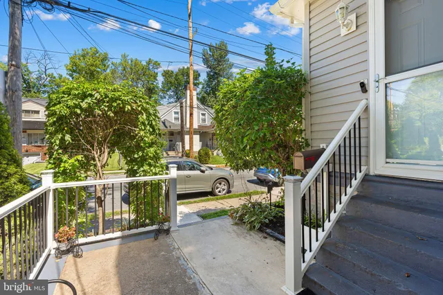 a view of balcony with wooden floor and fence