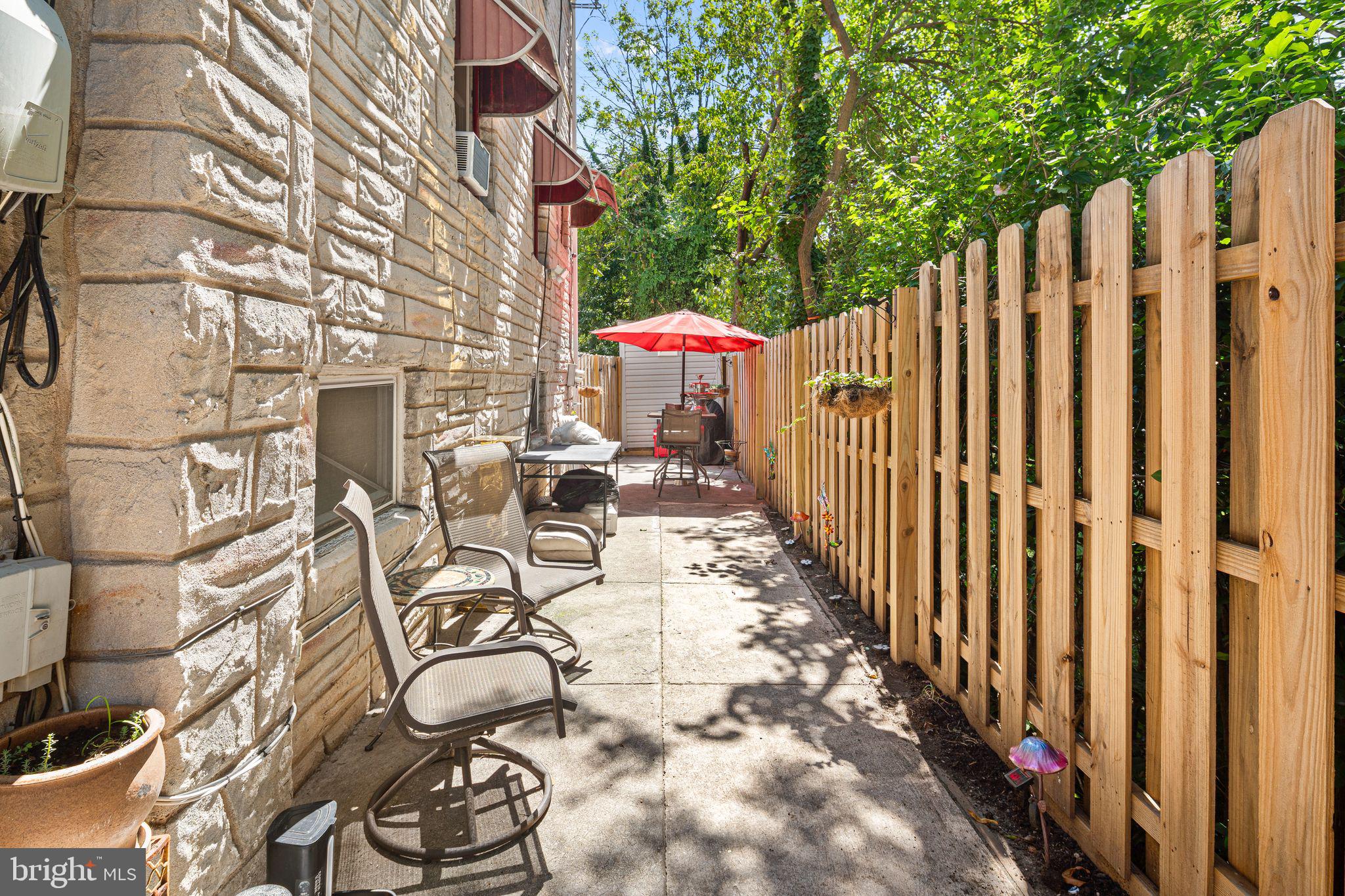 144 Fairview Avenue Lansdowne, PA 19050 - Photo 31 of 39 a view of a patio with table and chairs with wooden fence