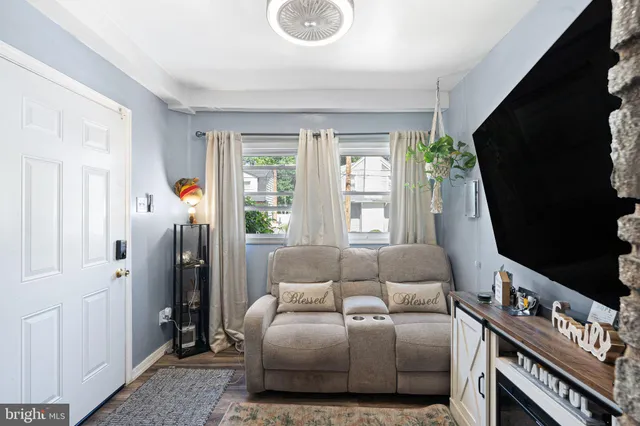 a bedroom with furniture and a flat screen tv