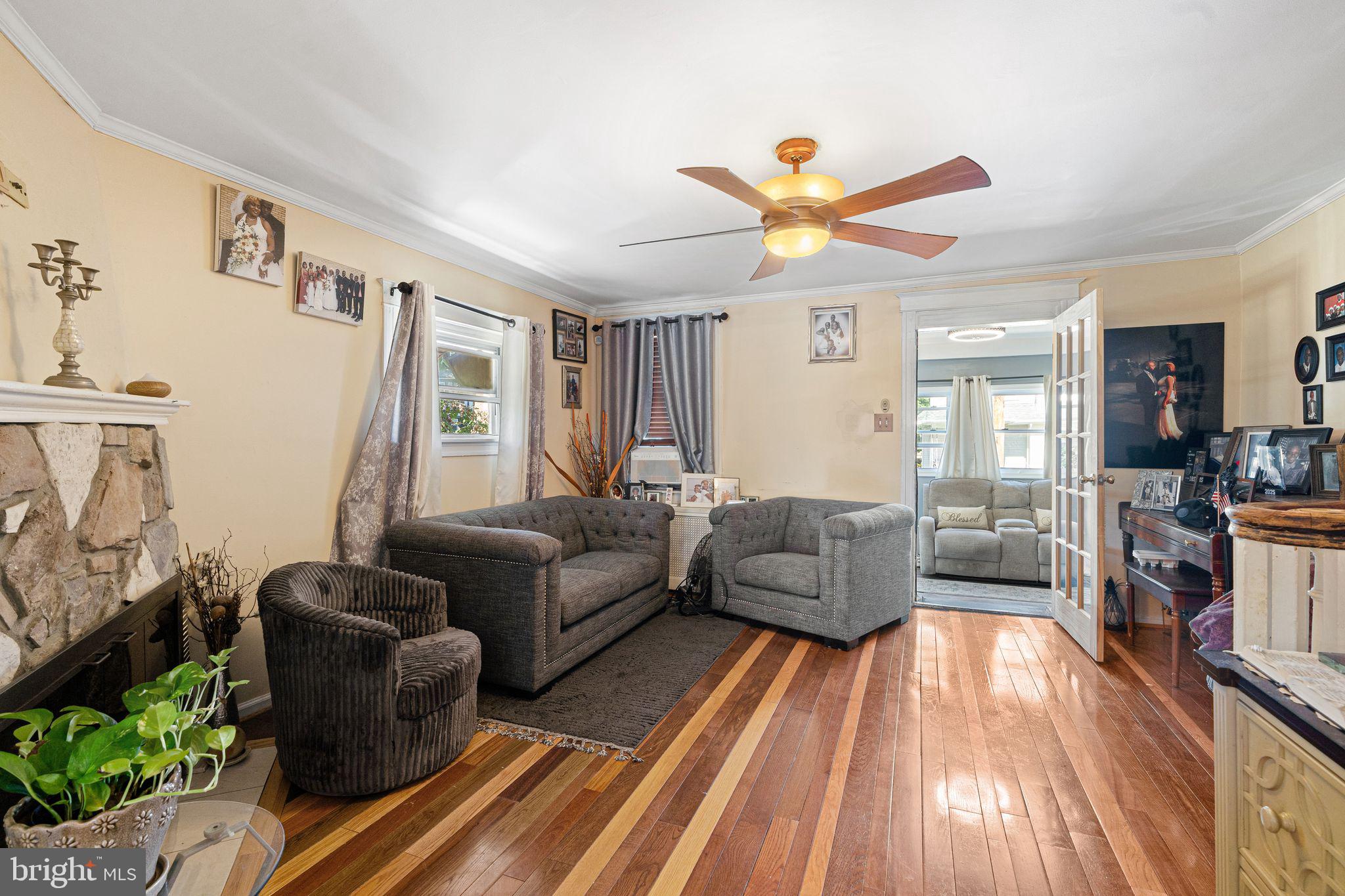 144 Fairview Avenue Lansdowne, PA 19050 - Photo 7 of 39 a living room with furniture and a wooden floor