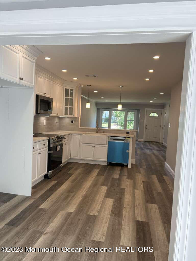 48 East Piazza Tasso Freehold, NJ 07728 - Photo 11 of 21 a large kitchen with a stove a sink and a refrigerator