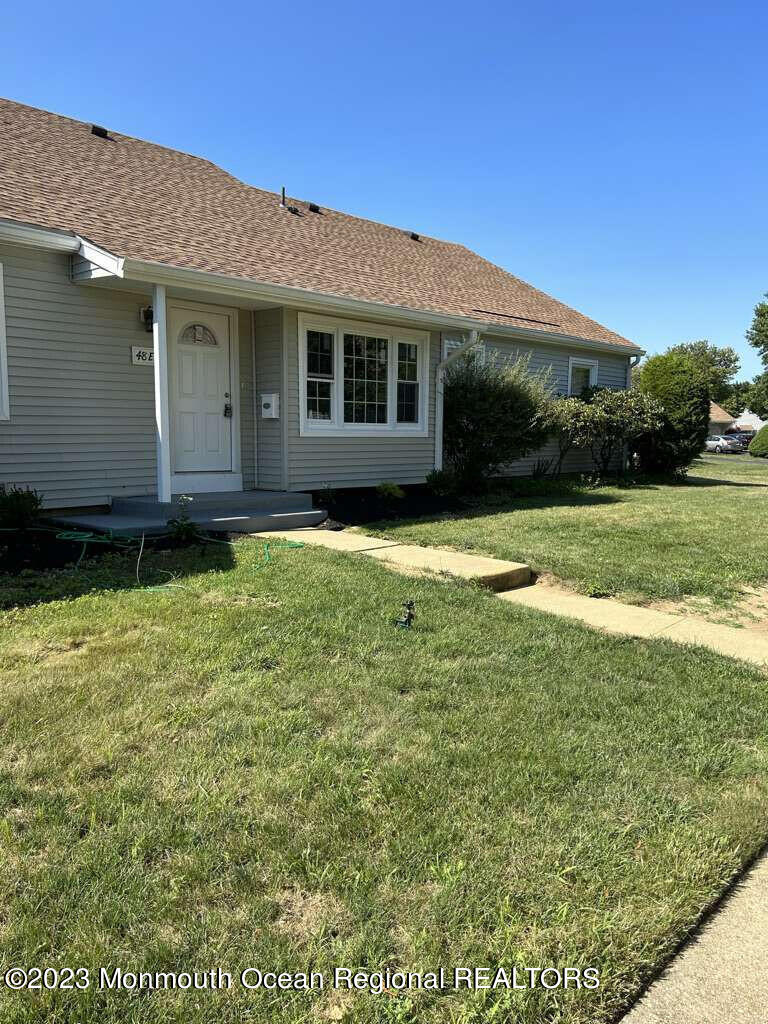48 East Piazza Tasso Freehold, NJ 07728 - Photo 17 of 21 a view of a house with a yard