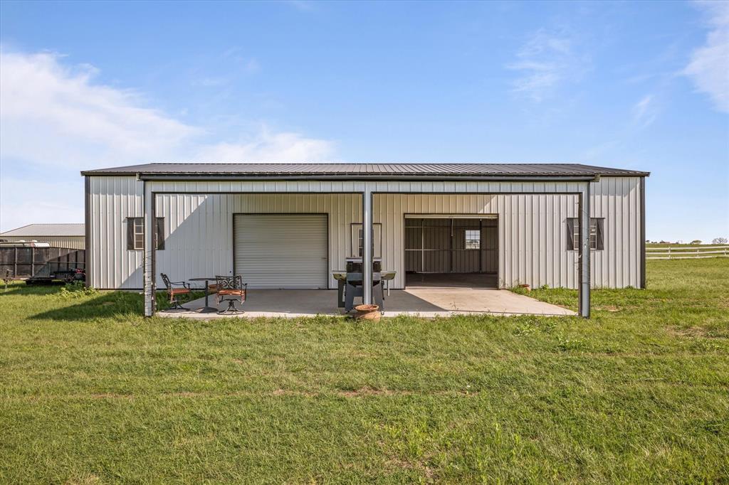 25 Cr 235 Valley View Valley View, TX 76272 - Photo 7 of 23 a front view of a house with a garden and yard