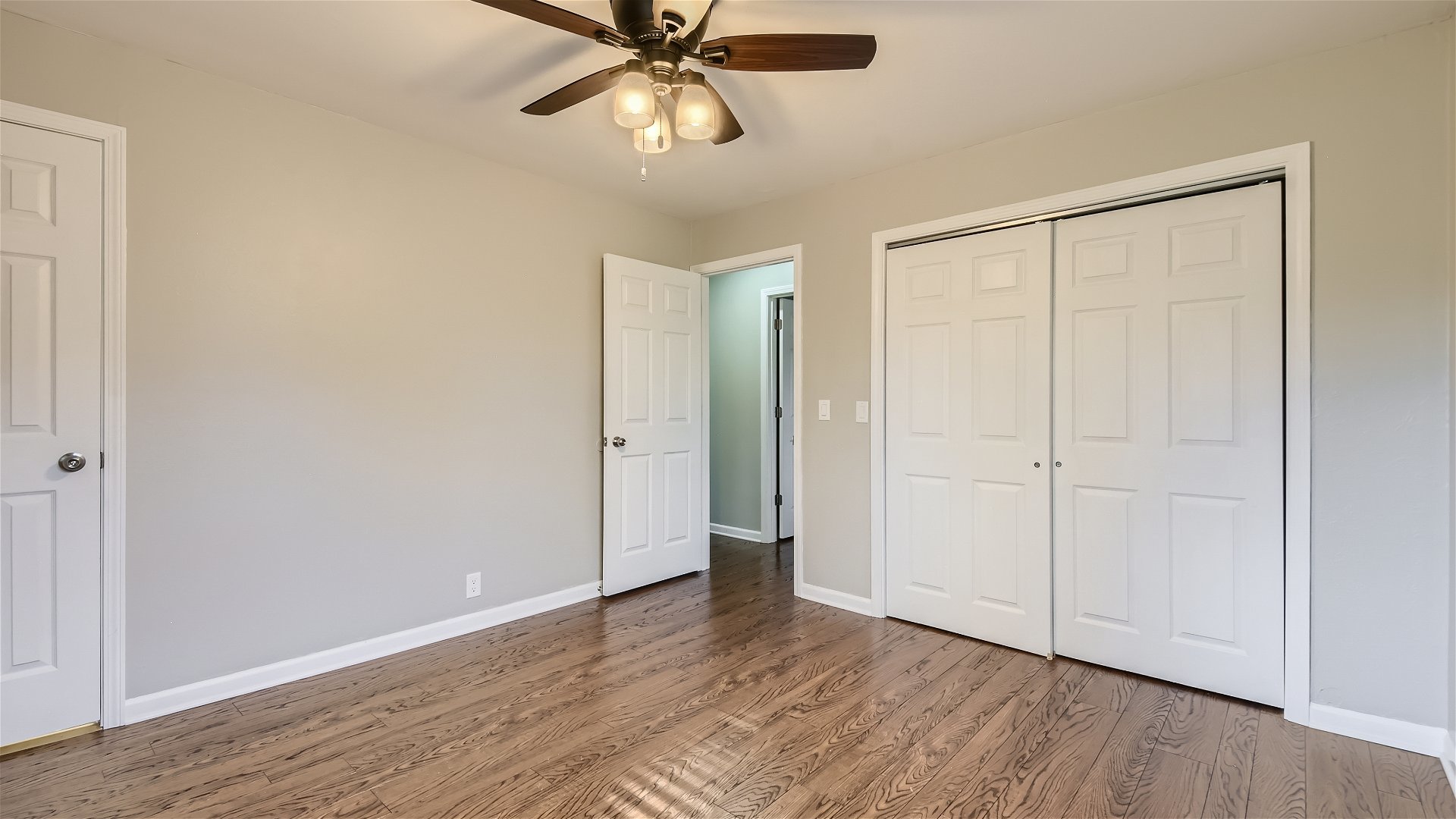 2438 Erskine Road Joliet, IL 60433 - Photo 13 of 42 a view of an empty room with wooden floor