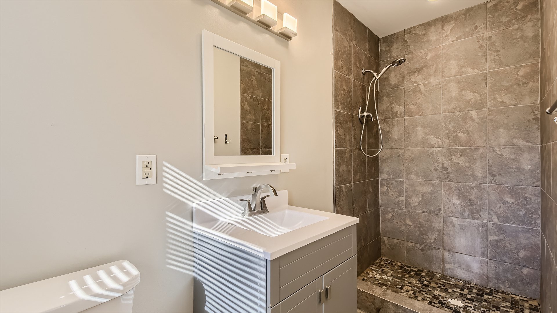 2438 Erskine Road Joliet, IL 60433 - Photo 15 of 42 a bathroom with a sink a toilet and shower