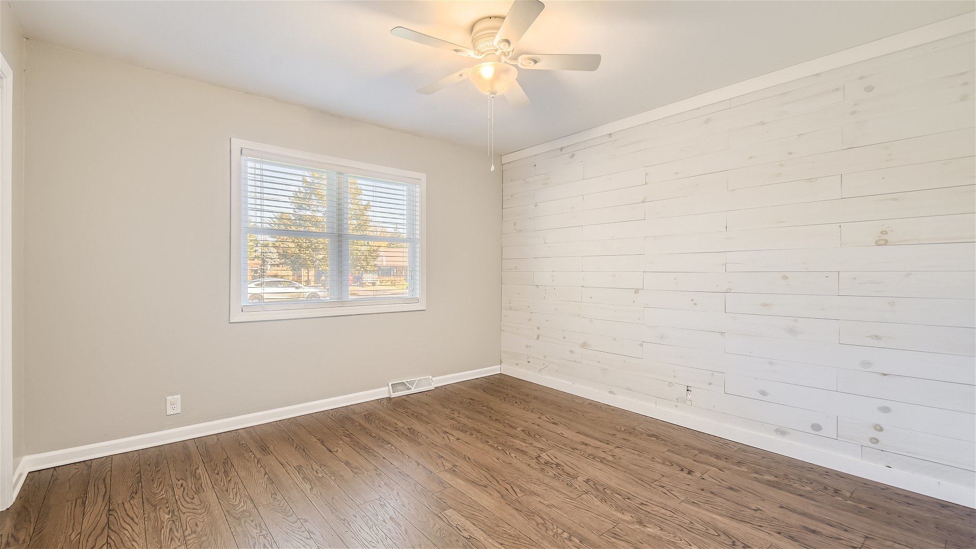 2438 Erskine Road Joliet, IL 60433 - Photo 16 of 42 wooden floor in an empty room with a window