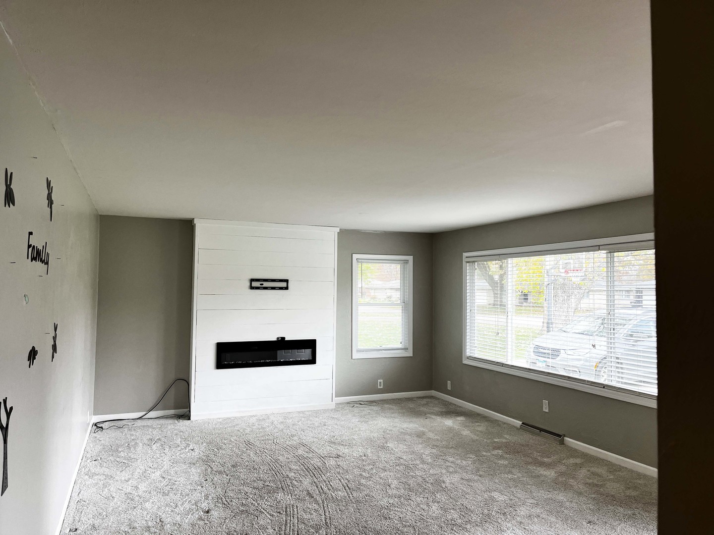 2438 Erskine Road Joliet, IL 60433 - Photo 21 of 42 a living room with a large window and mirror