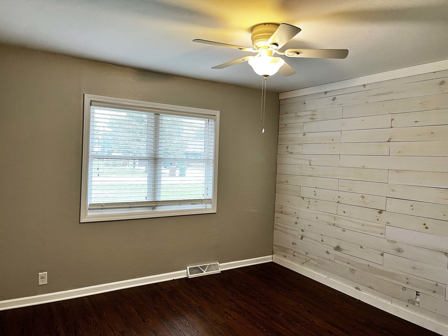 2438 Erskine Road Joliet, IL 60433 - Photo 28 of 42 a view of a workspace with wooden floor and a window