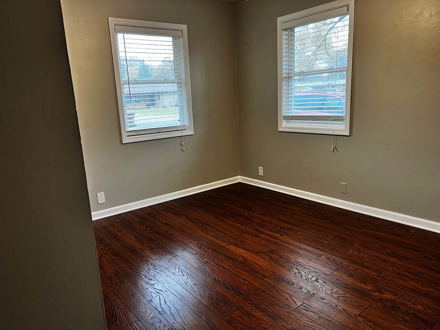 2438 Erskine Road Joliet, IL 60433 - Photo 34 of 42 an empty room with wooden floor and windows