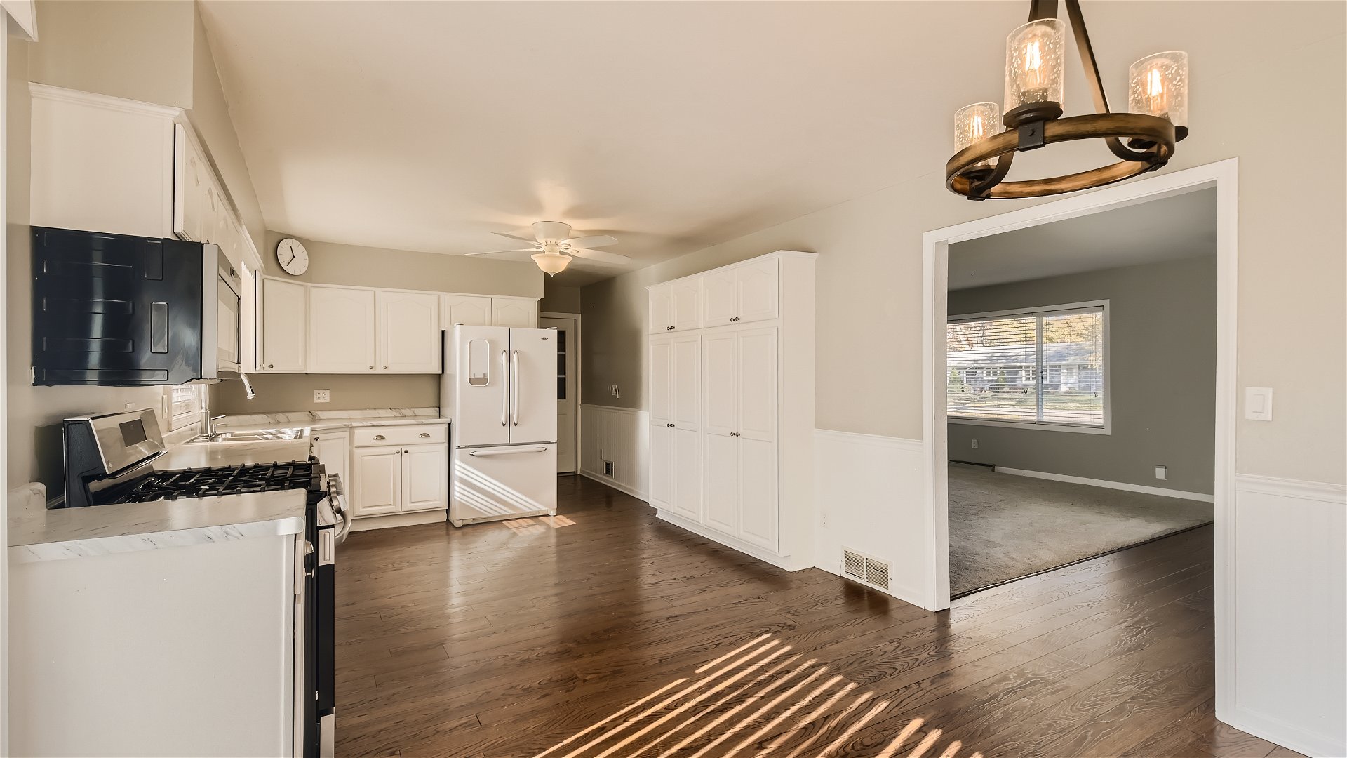 2438 Erskine Road Joliet, IL 60433 - Photo 9 of 42 a kitchen with a refrigerator and a stove top oven