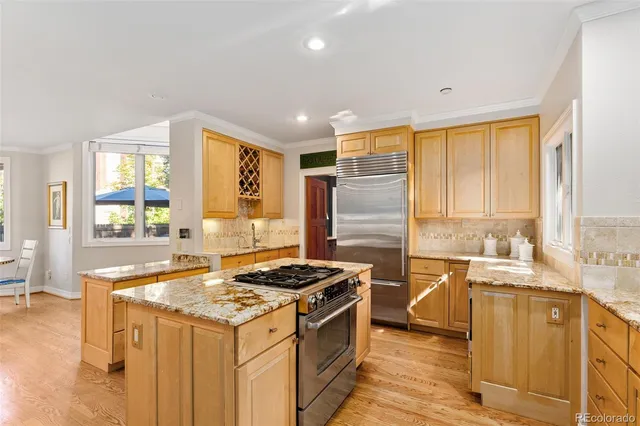 a kitchen that has a sink and a stove in it