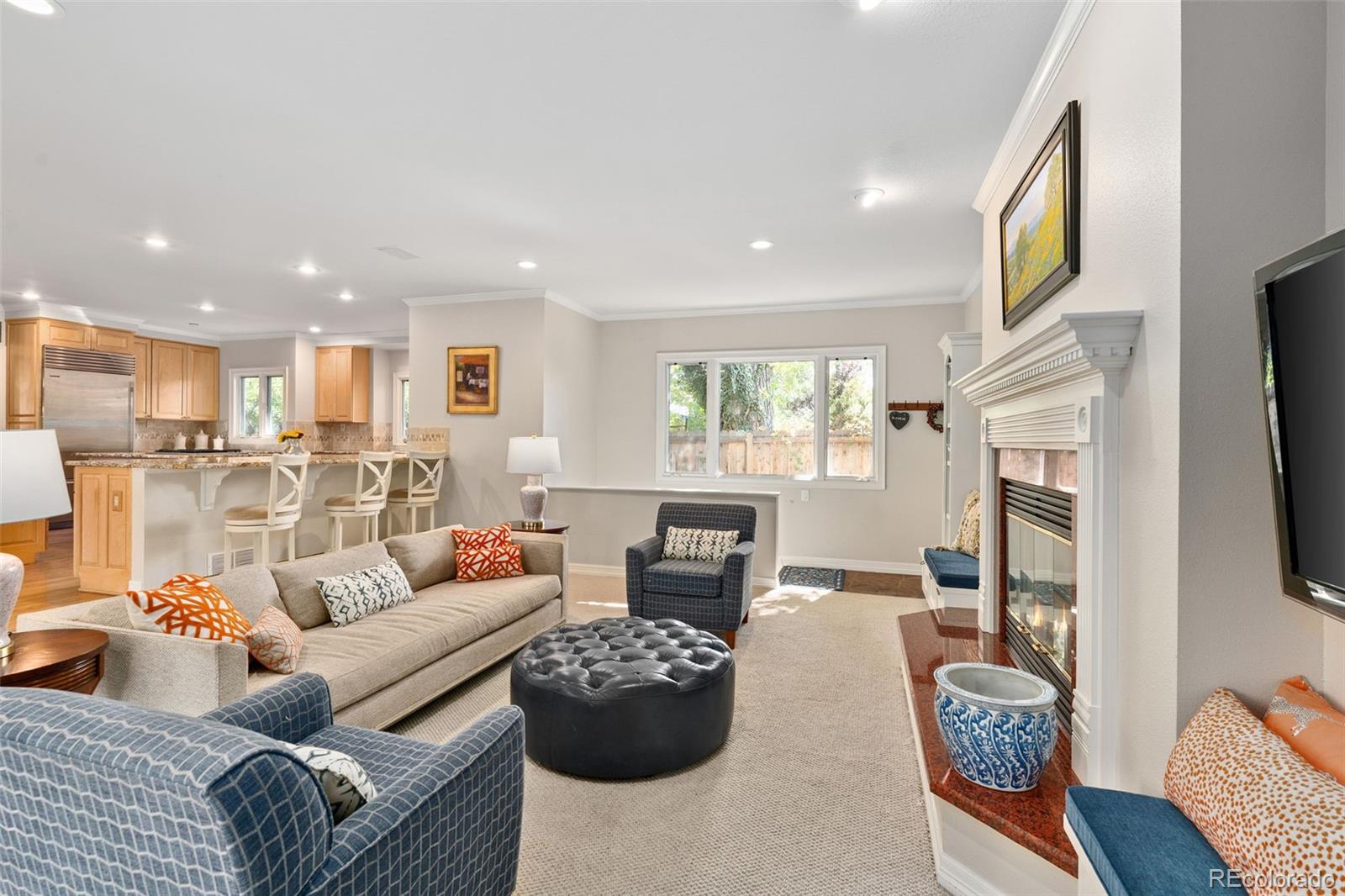 2435 South Fillmore Street Denver, CO 80210 - Photo 17 of 32 a living room with furniture and a flat screen tv