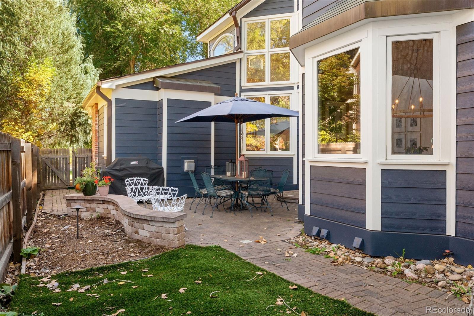 2435 South Fillmore Street Denver, CO 80210 - Photo 28 of 32 a view of a chair and table in backyard of the house