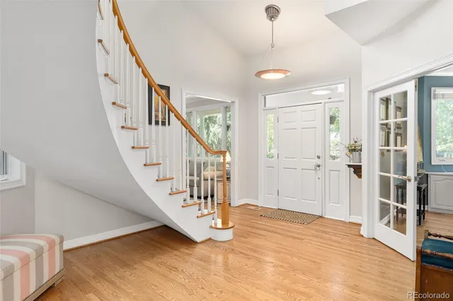 a view of entryway with stairs and wooden floor