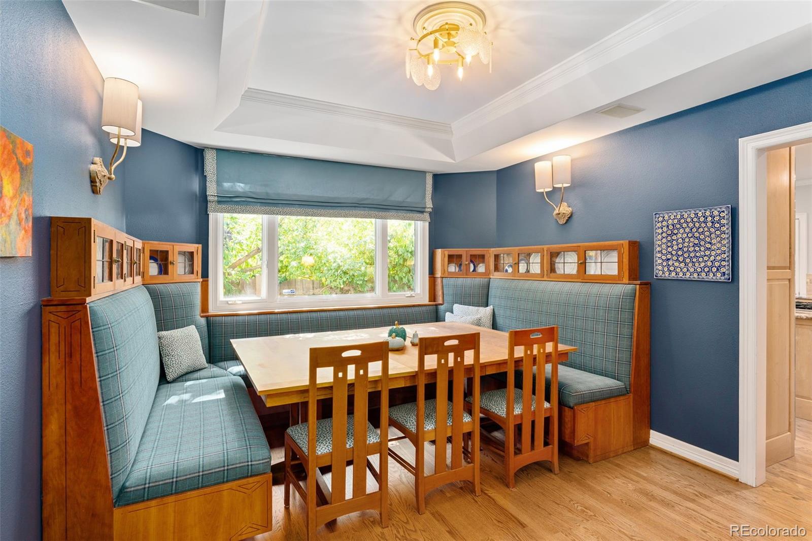 2435 South Fillmore Street Denver, CO 80210 - Photo 9 of 32 a dining room with furniture and a large window