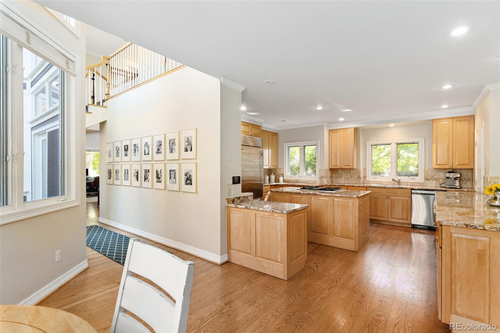 2435 South Fillmore Street Denver, CO 80210 - Photo 10 of 32 a kitchen with counter top space and wooden floor