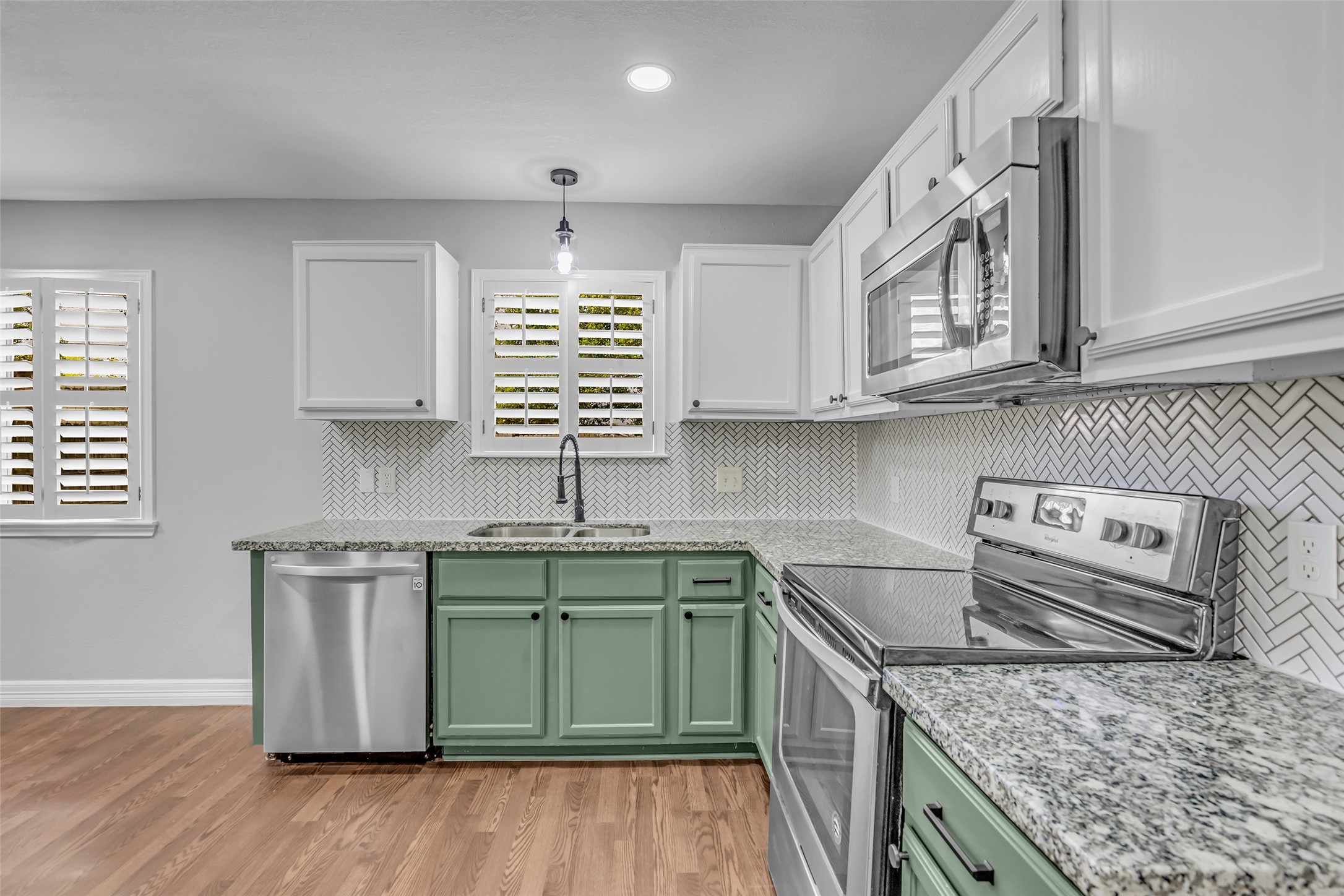 4795 Slade Ben Lane Alvin, TX 77511 - Photo 11 of 25 a kitchen with stainless steel appliances granite countertop a sink stove and cabinets