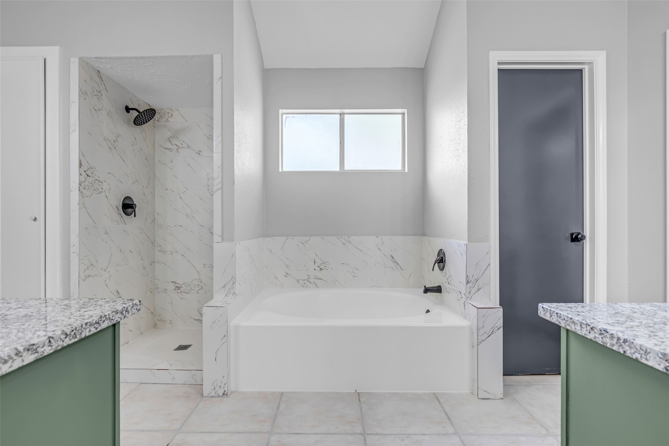 4795 Slade Ben Lane Alvin, TX 77511 - Photo 16 of 25 a white bath tub sitting in a bathroom and mirror