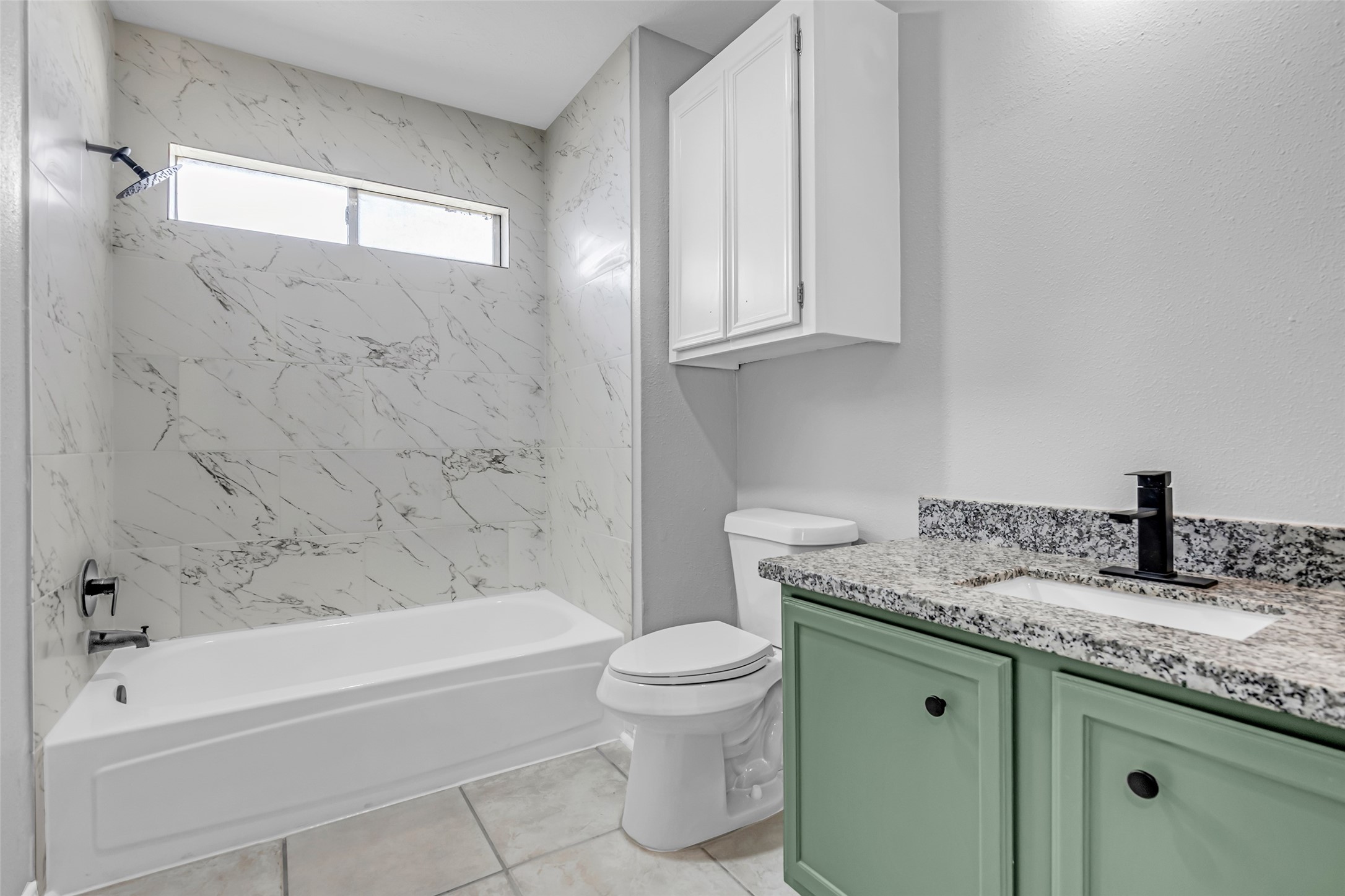 4795 Slade Ben Lane Alvin, TX 77511 - Photo 19 of 25 a bathroom with a granite countertop sink a toilet and bathtub
