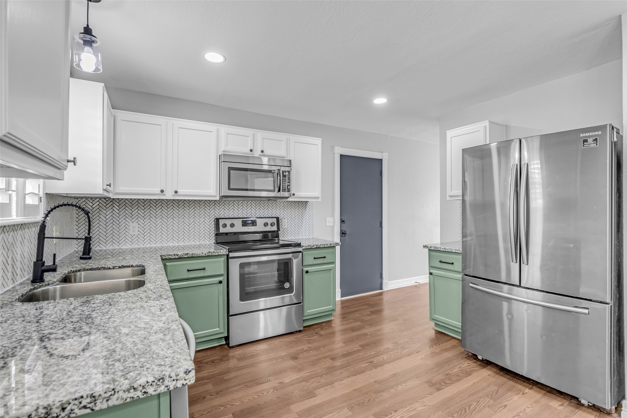 4795 Slade Ben Lane Alvin, TX 77511 - Photo 2 of 25 a kitchen with stainless steel appliances granite countertop a refrigerator sink and stove