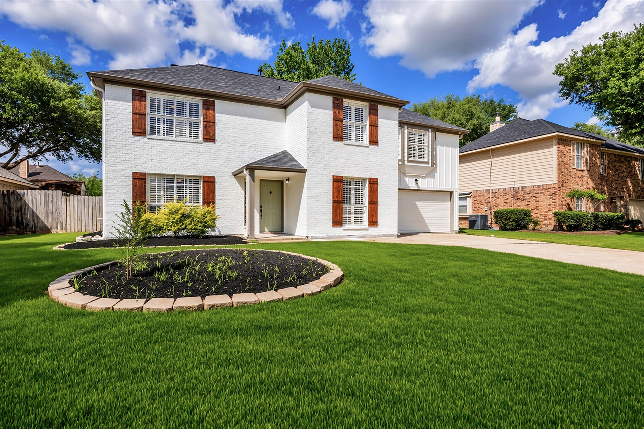 4795 Slade Ben Lane Alvin, TX 77511 - Photo 24 of 25 a front view of a house with a garden