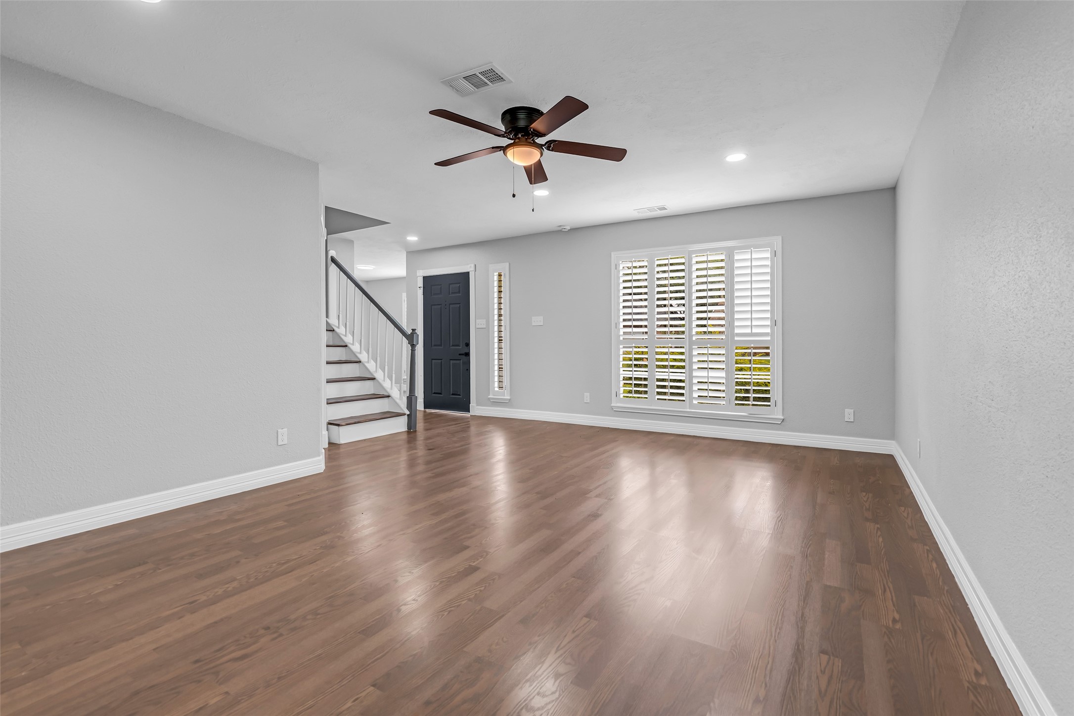 4795 Slade Ben Lane Alvin, TX 77511 - Photo 5 of 25 wooden floor in an empty room with a window