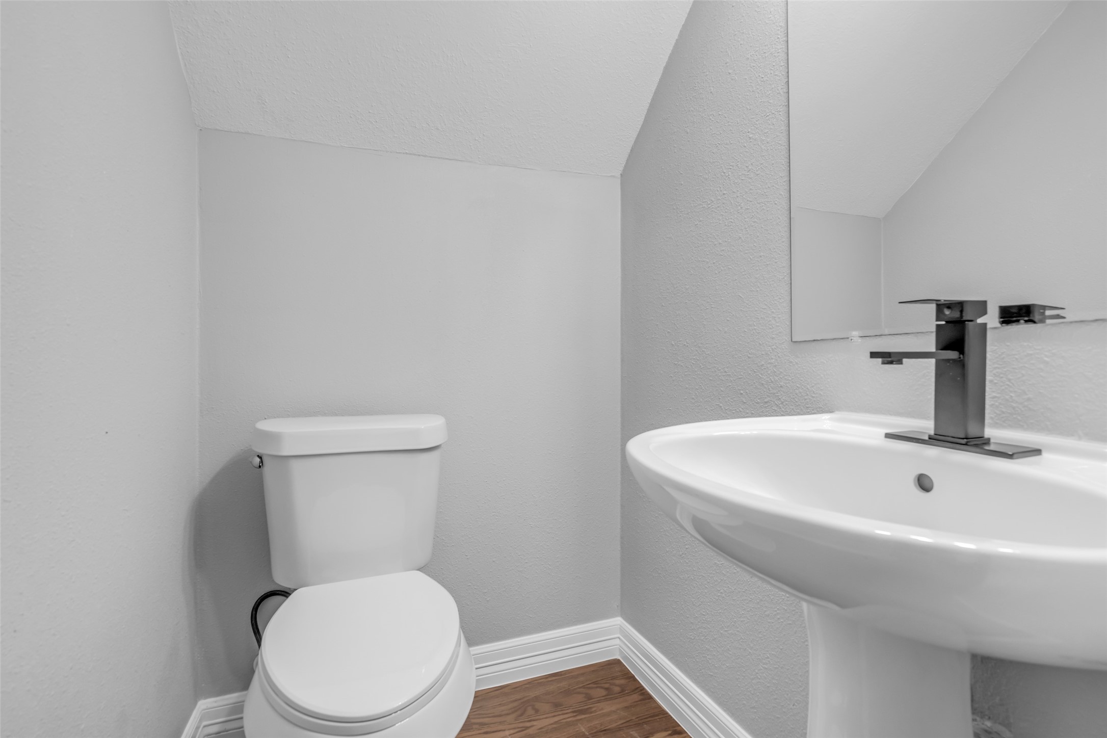 4795 Slade Ben Lane Alvin, TX 77511 - Photo 9 of 25 a white toilet sitting next to a white sink