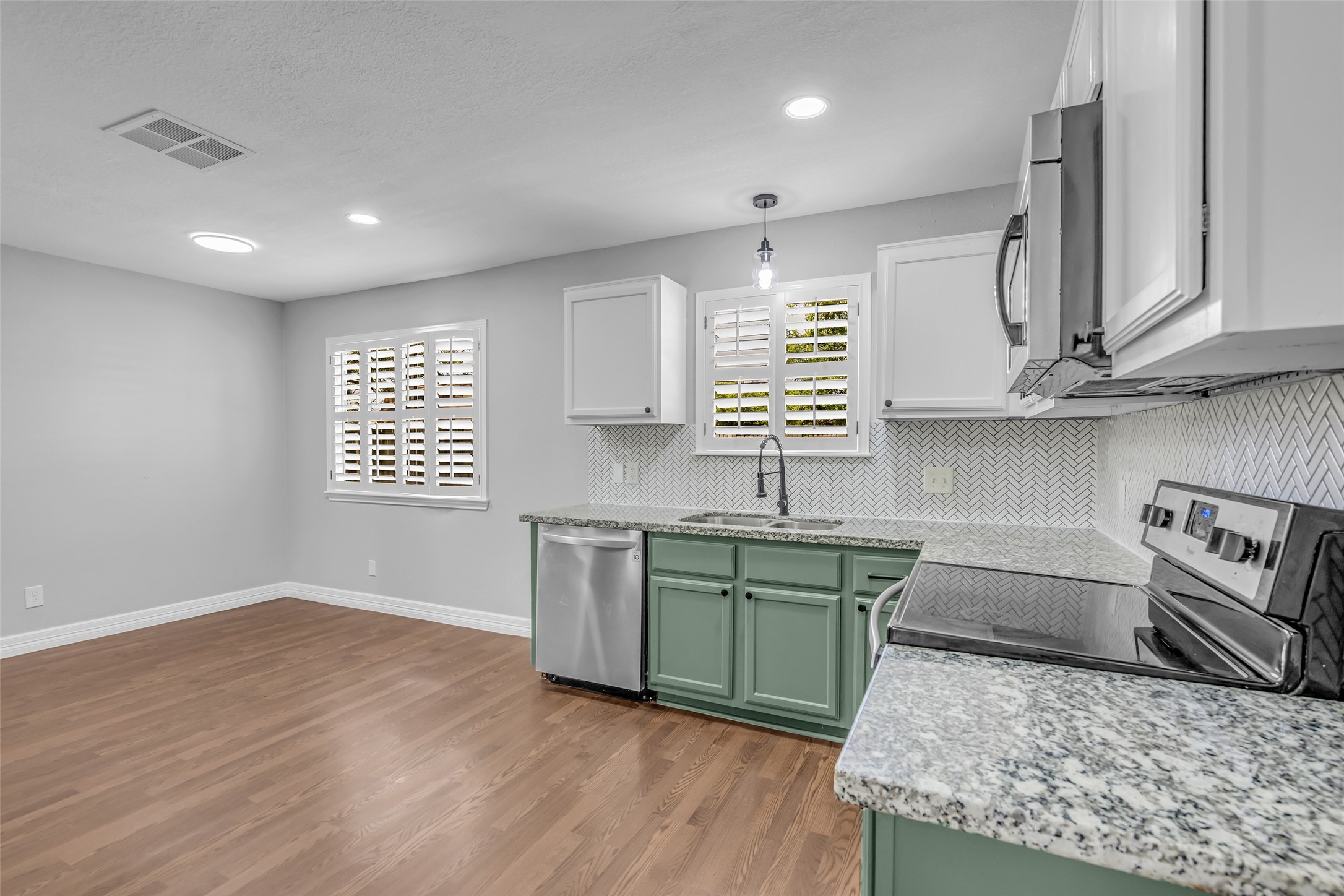 4795 Slade Ben Lane Alvin, TX 77511 - Photo 10 of 25 a kitchen with stainless steel appliances granite countertop a sink stove and cabinets