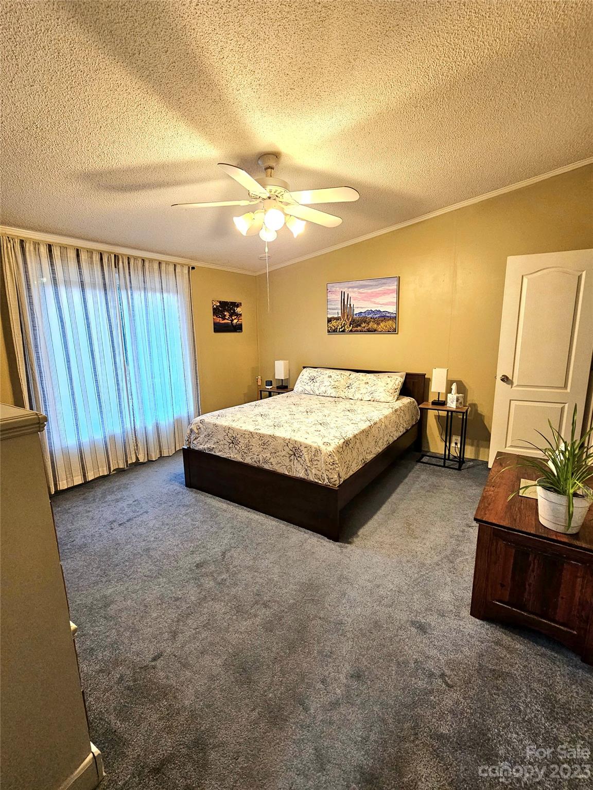 224 McDaniel Road Blacksburg, SC 29702 - Photo 12 of 20 a spacious bedroom with a bed and a view in background