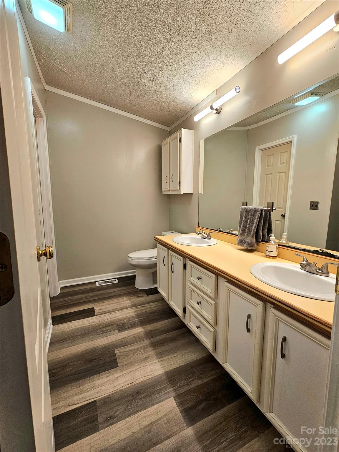 224 McDaniel Road Blacksburg, SC 29702 - Photo 14 of 20 a spacious bathroom with double vanity and mirrors