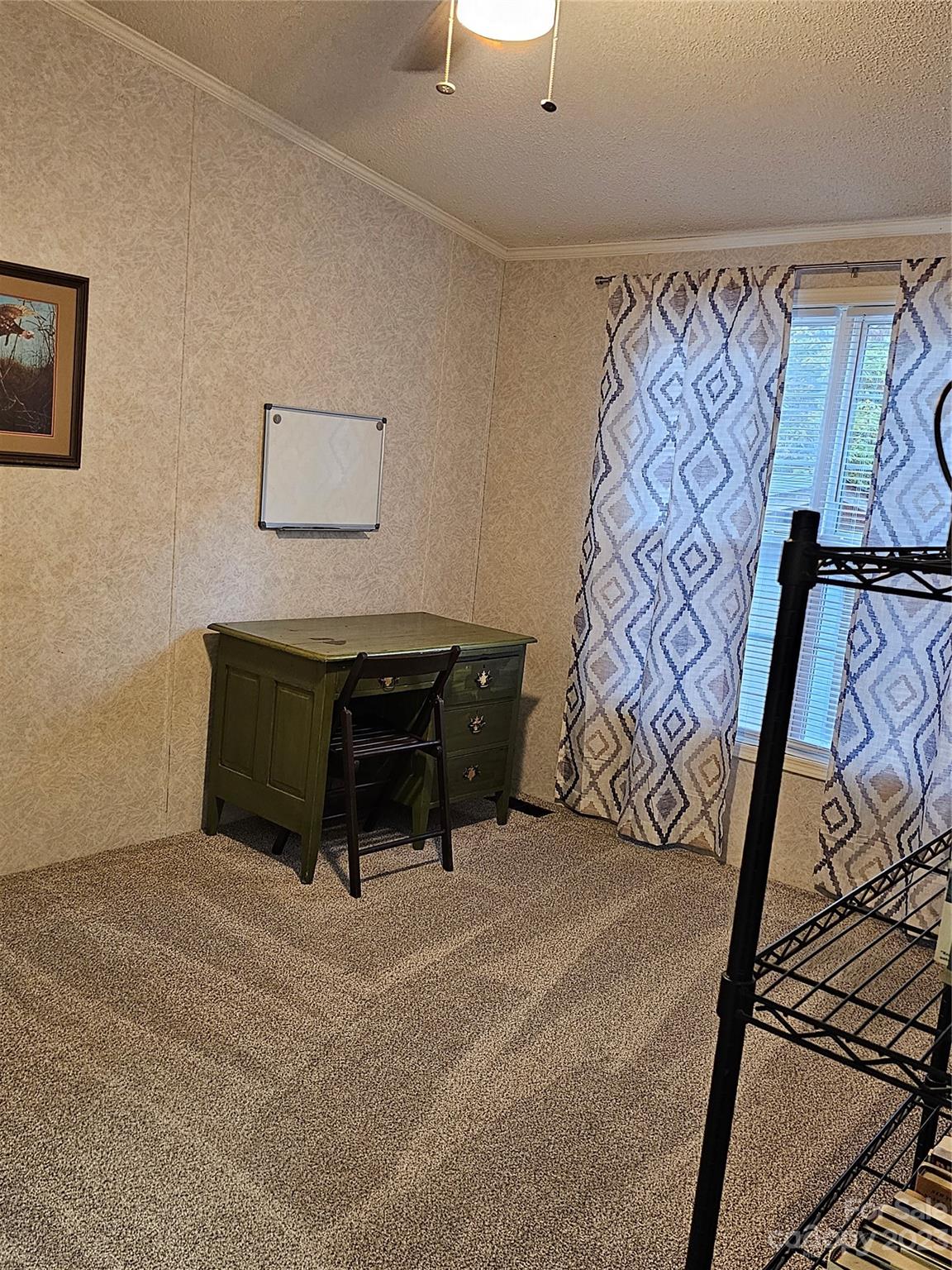 224 McDaniel Road Blacksburg, SC 29702 - Photo 15 of 20 a bedroom with a bed and a window